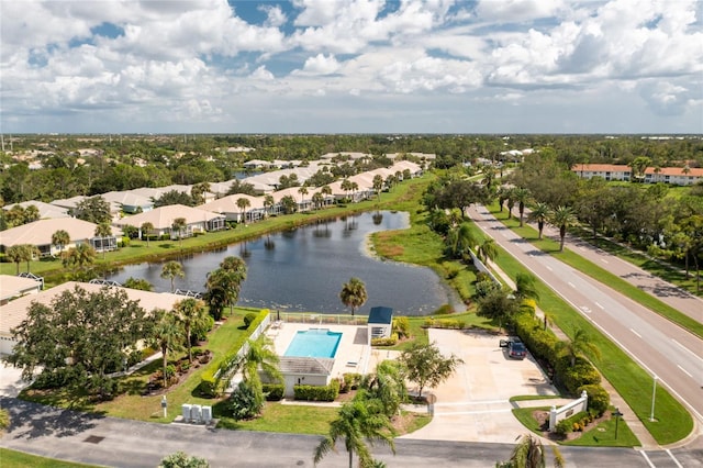 drone / aerial view with a water view and a residential view