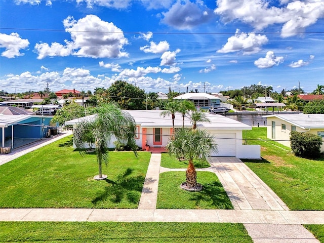544 Lindley Ter, Port Charlotte, FL 33952 - view of front facade with a garage, a front yard, and driveway