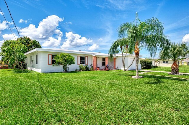 544 Lindley Ter, Port Charlotte, FL 33952 - ranch-style house with a front lawn