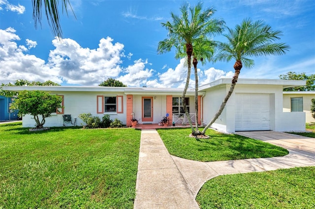 single story home featuring a garage, covered porch, and a front lawn