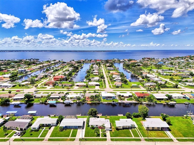 drone / aerial view with a water view