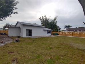 view of property exterior with a lawn