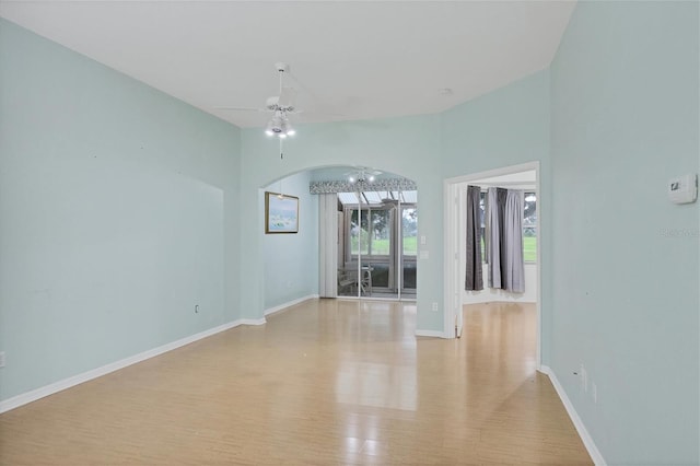 empty room featuring ceiling fan and light hardwood / wood-style flooring