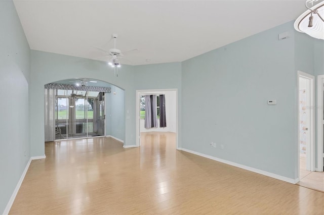 empty room featuring ceiling fan and light wood-type flooring