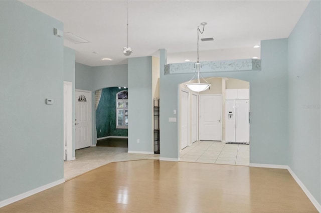 spare room with light wood-type flooring