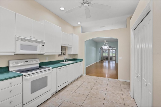 kitchen with ceiling fan, light wood-type flooring, white cabinetry, sink, and white appliances