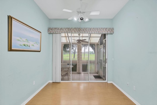 spare room featuring ceiling fan and light wood-type flooring