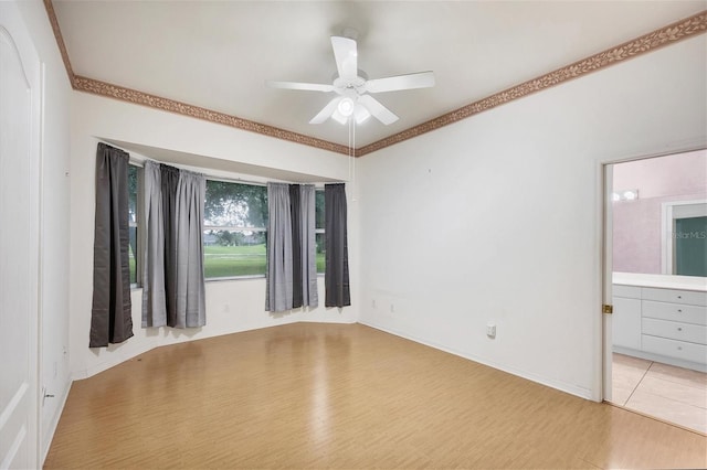 unfurnished room with ceiling fan, light hardwood / wood-style flooring, and ornamental molding