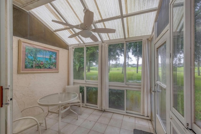 sunroom with ceiling fan and lofted ceiling