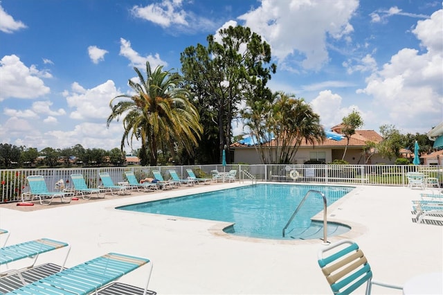 view of swimming pool with a patio