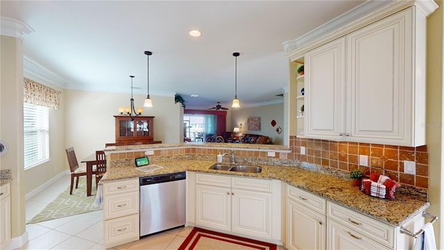 kitchen with crown molding, tasteful backsplash, stainless steel dishwasher, a sink, and a peninsula