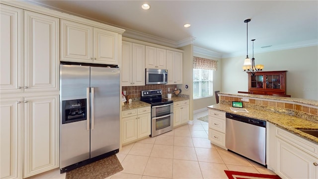 kitchen featuring decorative light fixtures, crown molding, stainless steel appliances, backsplash, and light tile patterned flooring