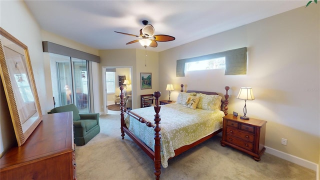 bedroom featuring light carpet, a ceiling fan, and baseboards