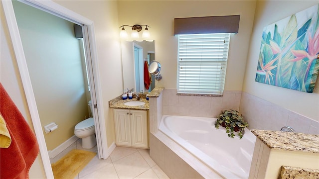 full bathroom featuring a garden tub, vanity, toilet, and tile patterned floors