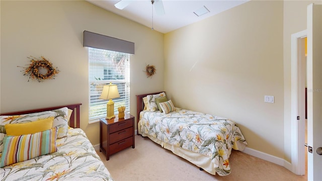 bedroom featuring light colored carpet, multiple windows, ceiling fan, and baseboards