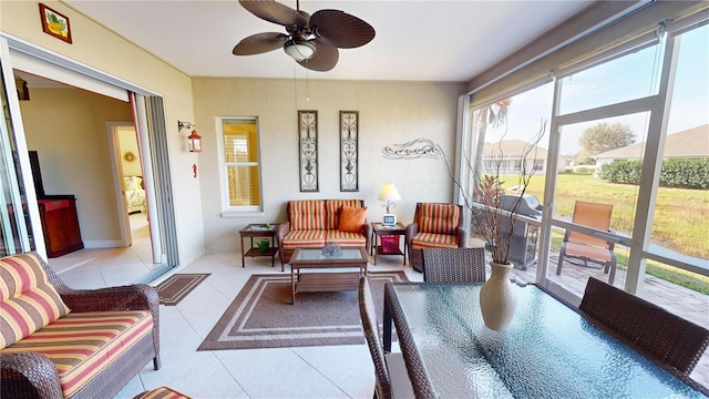 sunroom with ceiling fan