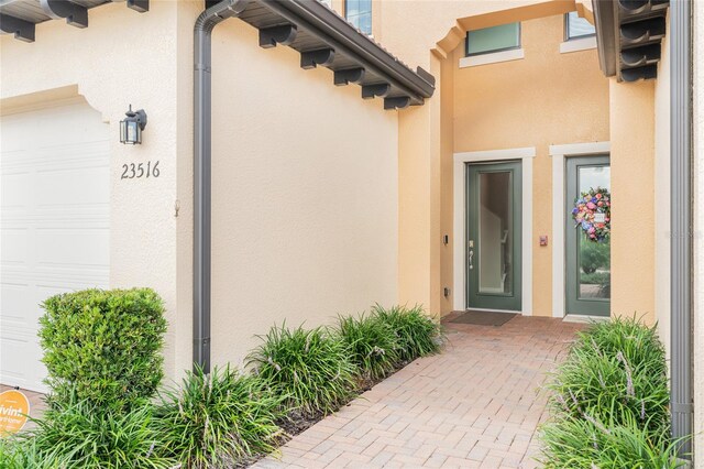 doorway to property featuring a garage