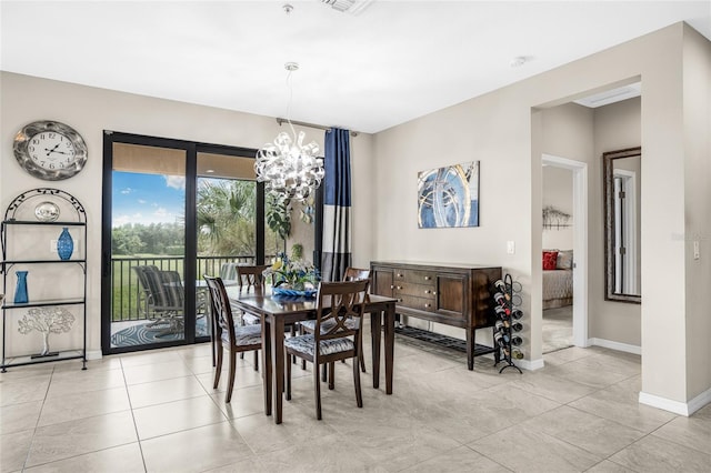 tiled dining space featuring a notable chandelier