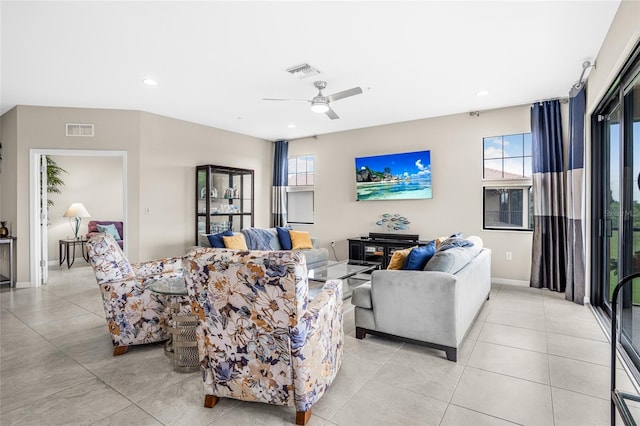 tiled living room featuring ceiling fan