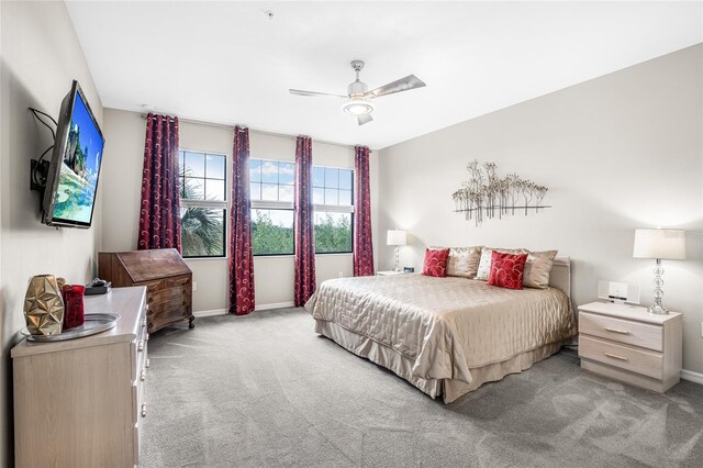 bedroom featuring ceiling fan and light colored carpet