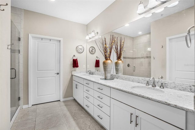 bathroom with tile patterned floors, walk in shower, and vanity