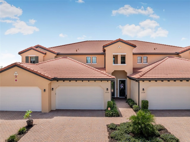 mediterranean / spanish-style home featuring a garage