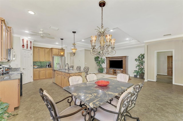 dining space featuring recessed lighting, ceiling fan with notable chandelier, visible vents, a raised ceiling, and crown molding