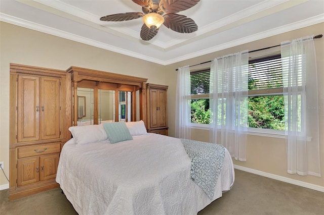 bedroom featuring ceiling fan, carpet floors, crown molding, and multiple windows