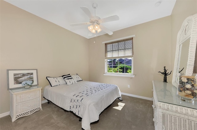 bedroom featuring a ceiling fan, baseboards, and carpet flooring