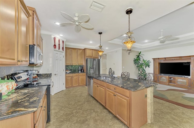 kitchen with backsplash, stainless steel appliances, crown molding, decorative light fixtures, and a center island with sink