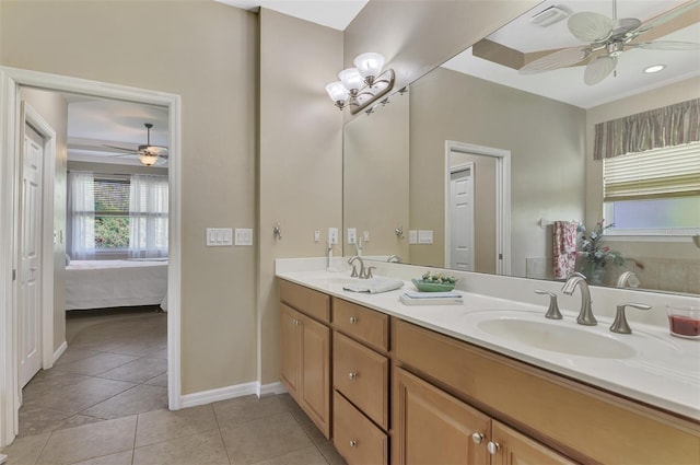 bathroom with tile patterned flooring, vanity, and ceiling fan