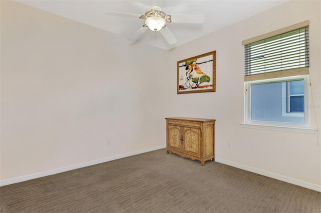 spare room featuring carpet flooring and ceiling fan