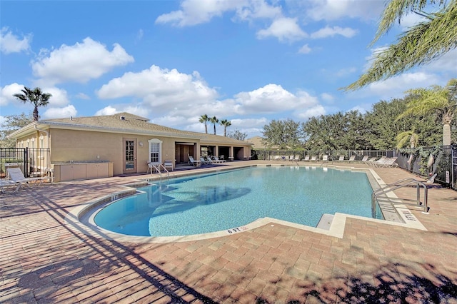 view of swimming pool featuring a patio area