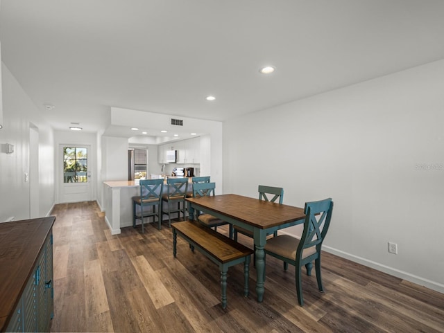 dining room with dark wood-type flooring