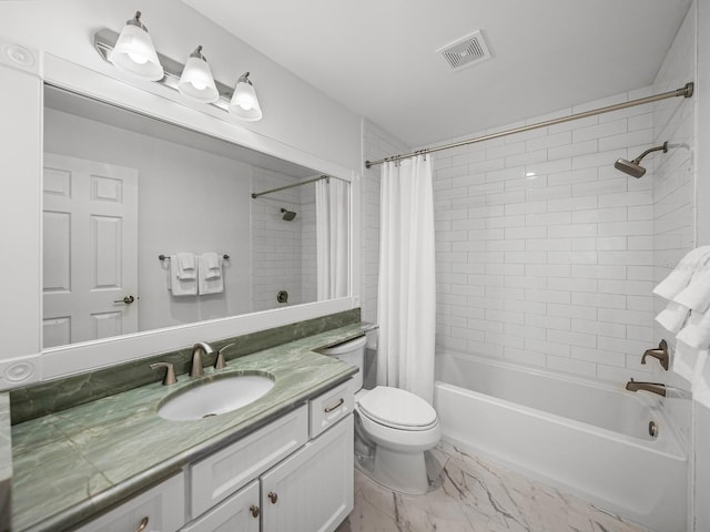 full bathroom featuring vanity, shower / bath combo, and toilet