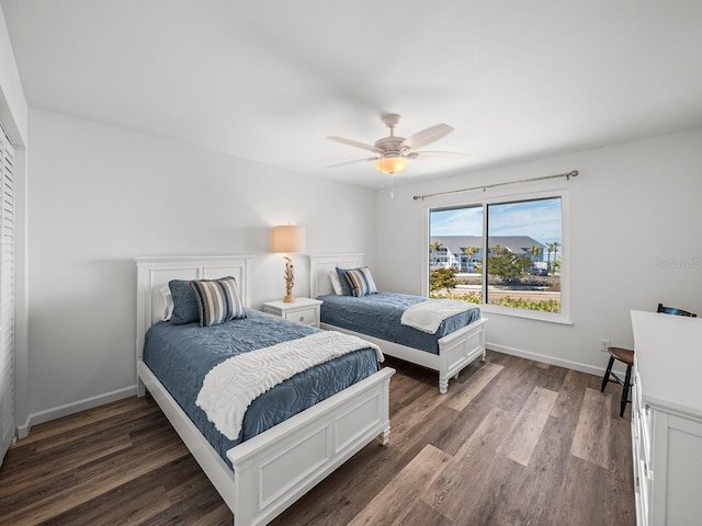 bedroom with ceiling fan and dark hardwood / wood-style flooring