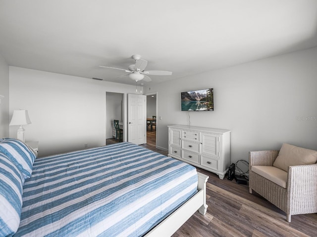 bedroom featuring dark wood-type flooring and ceiling fan