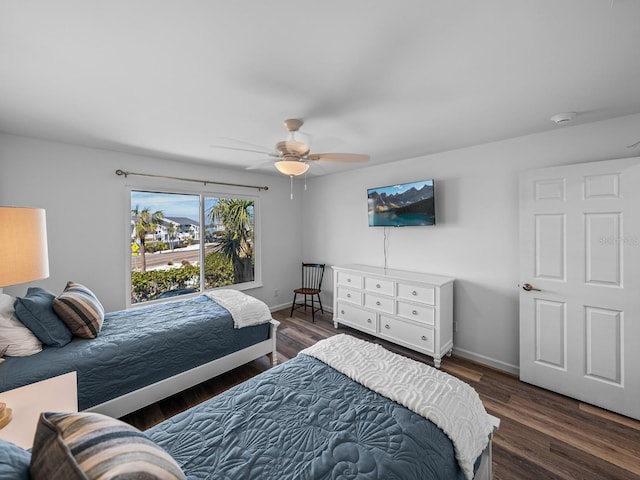 bedroom featuring dark hardwood / wood-style flooring and ceiling fan