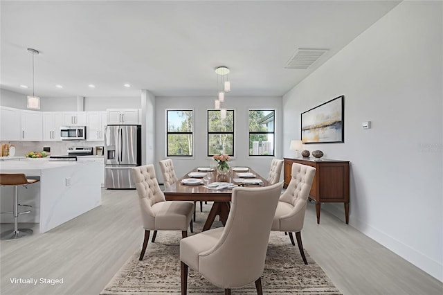 9262 Genesee St, Port Charlotte, FL 33981 - dining space featuring light wood finished floors and recessed lighting