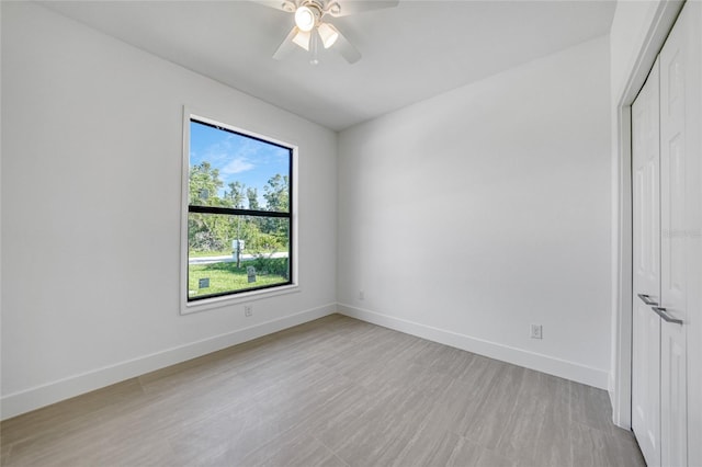 9262 Genesee St, Port Charlotte, FL 33981 - empty room featuring a ceiling fan and light wood-style flooring