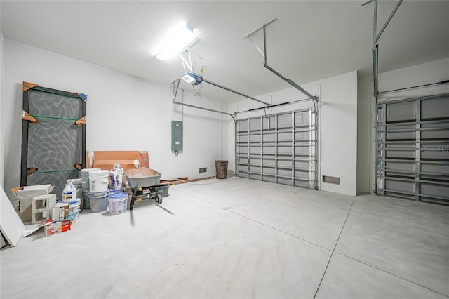 9262 Genesee St, Port Charlotte, FL 33981 - garage featuring a garage door opener and electric panel