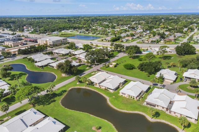 bird's eye view with a water view