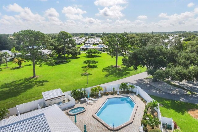 view of swimming pool with an outdoor hot tub and a patio area