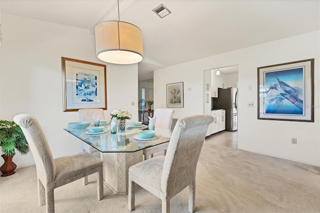 view of carpeted dining room