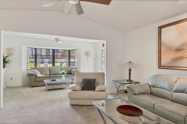 carpeted living room with ceiling fan and vaulted ceiling