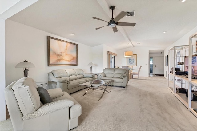 carpeted living room featuring ceiling fan and lofted ceiling