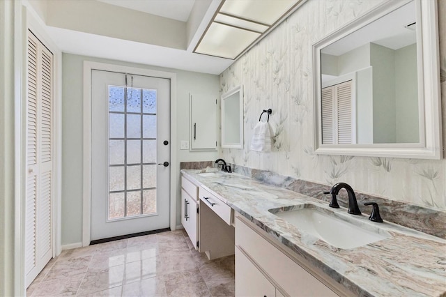 bathroom featuring vanity and a wealth of natural light