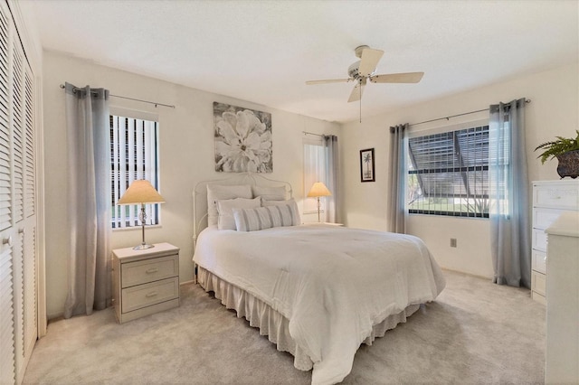 carpeted bedroom with ceiling fan