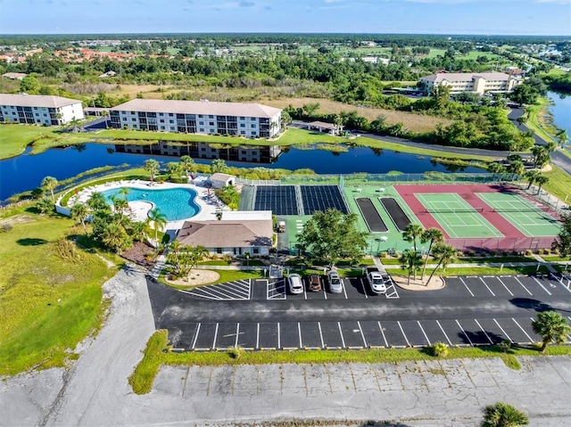 birds eye view of property with a water view