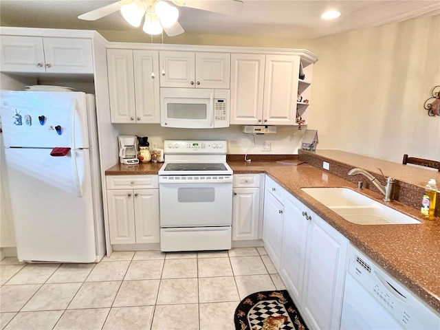 kitchen with sink, white appliances, ceiling fan, white cabinetry, and light tile patterned flooring